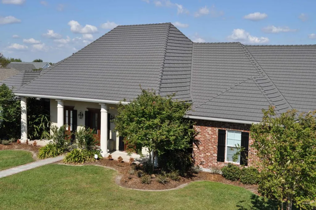 house exterior with brand new grey shingle roofing
