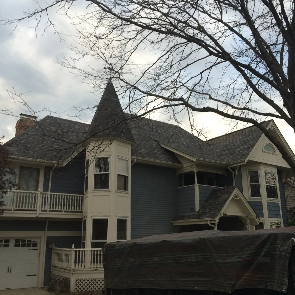 shingle roofing repair on the large house